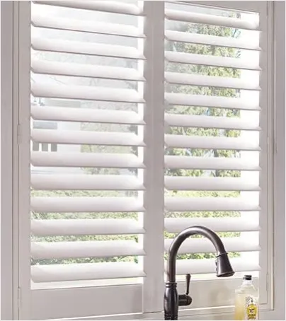 A close-up of custom plantation shutter louvers showing detail and wood texture